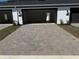 Spacious brick driveway leading to the attached garage, creating a welcoming approach to this attractive home at 652 Pothos St, Apopka, FL 32703