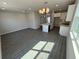 Open-concept living space showing living room, kitchen island, and modern chandelier at 652 Pothos St, Apopka, FL 32703