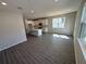 Open living space featuring a spacious living room with a connected kitchen with a center island at 652 Pothos St, Apopka, FL 32703