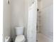 Bathroom featuring a toilet, shower and a shower curtain at 7336 Daniel Webster Dr # 9, Winter Park, FL 32792