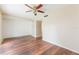 Spacious living room featuring hardwood floors and a ceiling fan at 7336 Daniel Webster Dr # 9, Winter Park, FL 32792