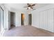 Spacious bedroom with a ceiling fan and double door closet at 7336 Daniel Webster Dr # 9, Winter Park, FL 32792