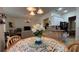 Cozy dining area with an decorative table and open view to the living area at 7415 Devereaux St, Reunion, FL 34747