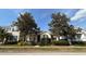 Charming single story home with mature trees and manicured landscaping at 7415 Devereaux St, Reunion, FL 34747