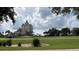 A resort building with lush greenery and palm trees at 7415 Devereaux St, Reunion, FL 34747