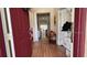 Welcoming foyer with hardwood floors and stylish decor leading into the home at 7415 Devereaux St, Reunion, FL 34747