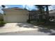 An attached two-car garage offers convenience at 7415 Devereaux St, Reunion, FL 34747