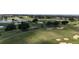 The manicured greens of the golf course wind through the community at 7415 Devereaux St, Reunion, FL 34747