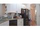 Functional kitchen area with white cabinetry and modern appliances at 7415 Devereaux St, Reunion, FL 34747