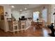 Bright kitchen with white cabinets, breakfast bar, and adjacent dining area at 7415 Devereaux St, Reunion, FL 34747