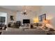 Comfortable living room featuring a neutral color palette and ample natural light at 7415 Devereaux St, Reunion, FL 34747