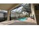 Relaxing screened-in pool area with comfortable lounge chairs and a beautiful view of the surrounding landscape at 7415 Devereaux St, Reunion, FL 34747