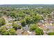Aerial view of the neighborhood showcases a quiet community with mature trees, lush landscaping at 821 Sutter Loop, Longwood, FL 32750