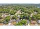 Aerial view of the neighborhood showcases a quiet community with mature trees, lush landscaping at 821 Sutter Loop, Longwood, FL 32750