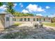 Large backyard features a brick patio, shed, mature trees, and a well-maintained lawn at 821 Sutter Loop, Longwood, FL 32750
