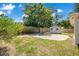 Spacious backyard with brick patio, shed, green grass, mature trees, and wooden perimeter fence at 821 Sutter Loop, Longwood, FL 32750