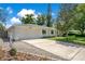A charming one-story home features an attached two-car garage and a long driveway leading to the street at 821 Sutter Loop, Longwood, FL 32750