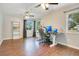 Home office featuring wood floors, windows for natural light, and plenty of desk space at 821 Sutter Loop, Longwood, FL 32750