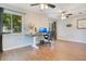 Spacious home office with hardwood floors, natural light, and two ceiling fans at 821 Sutter Loop, Longwood, FL 32750