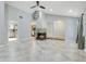 Inviting living space boasts tile flooring, a cozy fireplace, and an open view into the adjacent dining area and kitchen at 821 Sutter Loop, Longwood, FL 32750