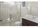 Clean and modern bathroom with glass-enclosed shower and updated vanity at 9007 Pelican Cove Trce, Kissimmee, FL 34747