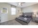 Modern bedroom showcasing a gray bed, matching nightstands, and contemporary wall art at 9007 Pelican Cove Trce, Kissimmee, FL 34747