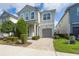 Charming two-story home featuring a well-maintained yard and attached garage at 9007 Pelican Cove Trce, Kissimmee, FL 34747