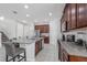 Open-concept kitchen with granite countertops, stainless steel appliances, and island at 9007 Pelican Cove Trce, Kissimmee, FL 34747