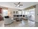 Comfortable living room with plush seating and access to the outdoor lanai at 9007 Pelican Cove Trce, Kissimmee, FL 34747
