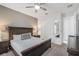 Comfortable bedroom with carpet, ceiling fan, and large windows for natural light at 9007 Pelican Cove Trce, Kissimmee, FL 34747