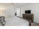 Comfortable bedroom with carpet, ceiling fan, and large windows for natural light at 9007 Pelican Cove Trce, Kissimmee, FL 34747