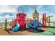 Colorful community playground with slides, climbing structures, and a castle tower for imaginative play at 9007 Pelican Cove Trce, Kissimmee, FL 34747