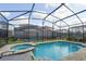 Private screened-in pool and spa area, creating a serene backyard retreat for leisure and recreation at 9007 Pelican Cove Trce, Kissimmee, FL 34747