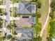 Picturesque aerial view of homes showcasing swimming pools, well-maintained yards, and a peaceful park at 9405 Bordet Ct, Orlando, FL 32827