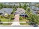 Aerial view of a home showcasing its well-maintained landscaping and prime location at 9405 Bordet Ct, Orlando, FL 32827