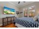 Well-appointed bedroom featuring hardwood floors, abundant natural light, and contemporary decor at 9405 Bordet Ct, Orlando, FL 32827