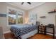 Inviting bedroom with hardwood floors, natural light, and comfortable furnishings at 9405 Bordet Ct, Orlando, FL 32827