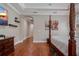 This bedroom features hardwood floors, a four-poster bed, and stylish decor with accent furniture at 9405 Bordet Ct, Orlando, FL 32827