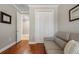 Comfortable room featuring hardwood floors, soft gray couch, and neutral color palette at 9405 Bordet Ct, Orlando, FL 32827