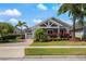 Charming single-story home with a well-manicured lawn, lush landscaping, and a welcoming covered porch at 9405 Bordet Ct, Orlando, FL 32827
