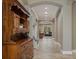Spacious foyer with arched doorways, decorative hutch, and a seamless flow into the living area at 9405 Bordet Ct, Orlando, FL 32827