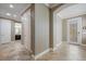 Open foyer featuring tile flooring, neutral walls, and a view into the adjacent bathroom at 9405 Bordet Ct, Orlando, FL 32827