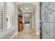 Elegant foyer with arched doorways, tile flooring, and a view into the living spaces at 9405 Bordet Ct, Orlando, FL 32827