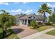 Attractive single-story home with a brick-paved driveway and well-maintained landscaping at 9405 Bordet Ct, Orlando, FL 32827