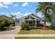 Charming single-story home featuring beautiful landscaping and a brick-paved driveway at 9405 Bordet Ct, Orlando, FL 32827