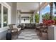 Relaxing front porch with comfortable wicker furniture and a stylish striped rug at 9405 Bordet Ct, Orlando, FL 32827