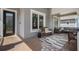 Inviting covered front porch featuring comfortable seating, a stylish rug, and a decorative pillow at 9405 Bordet Ct, Orlando, FL 32827