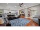 Open-concept living room connects to kitchen and office space at 9405 Bordet Ct, Orlando, FL 32827