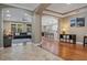 Open-concept living space with hardwood floors, modern furnishings, and abundant natural light at 9405 Bordet Ct, Orlando, FL 32827