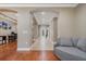 Spacious area featuring tile flooring, leading to the entry door and comfortable gray couch at 9405 Bordet Ct, Orlando, FL 32827
